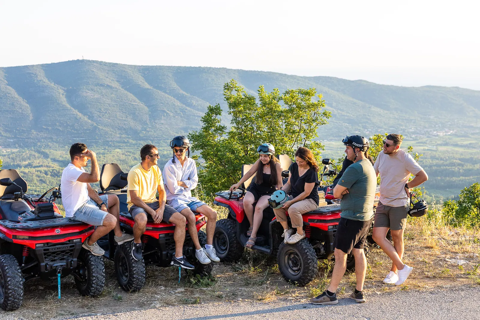 The group resting on their quads at the viewpoint rim