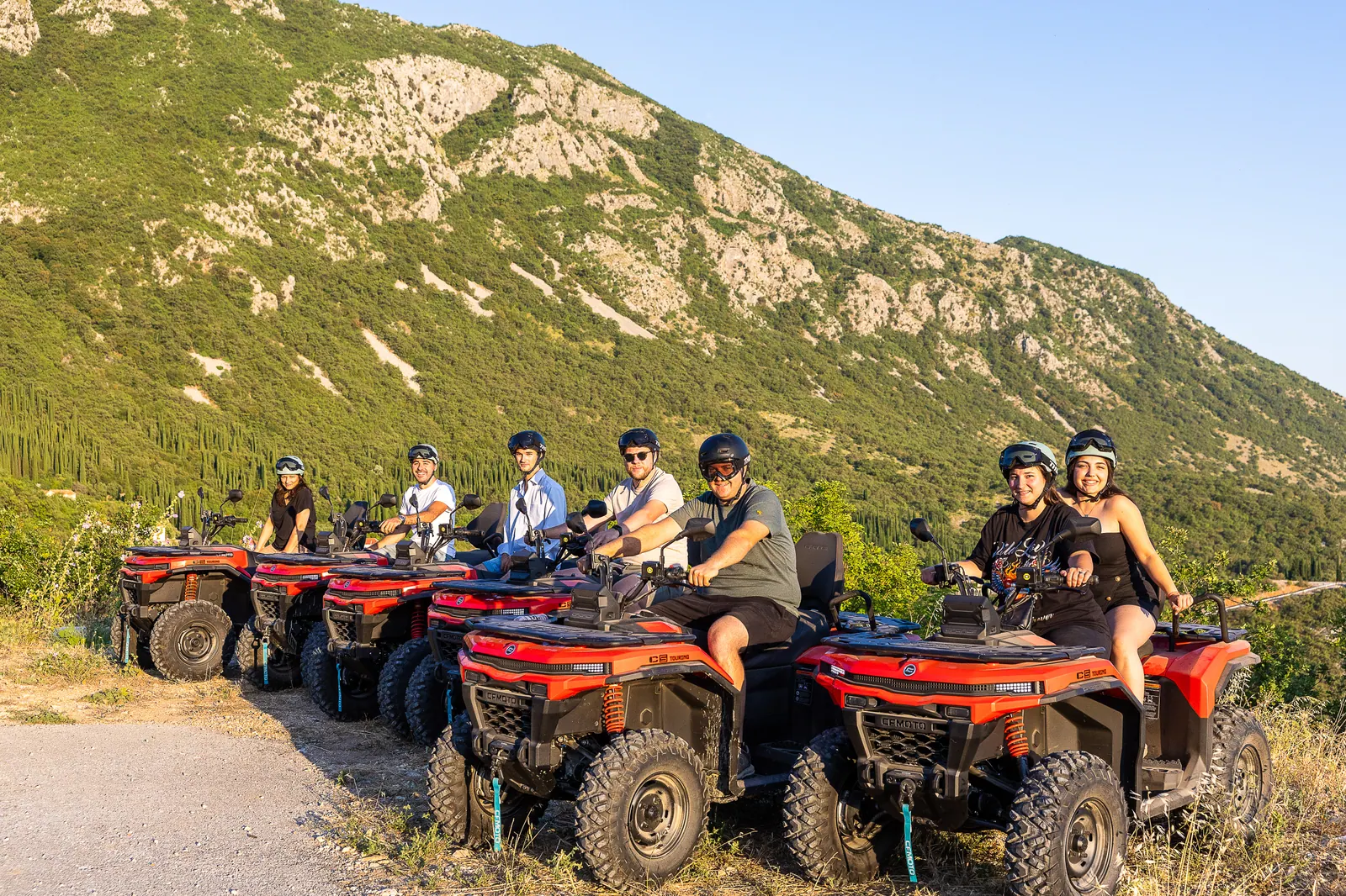 Golden hour lineup of quads under the mountain ridge