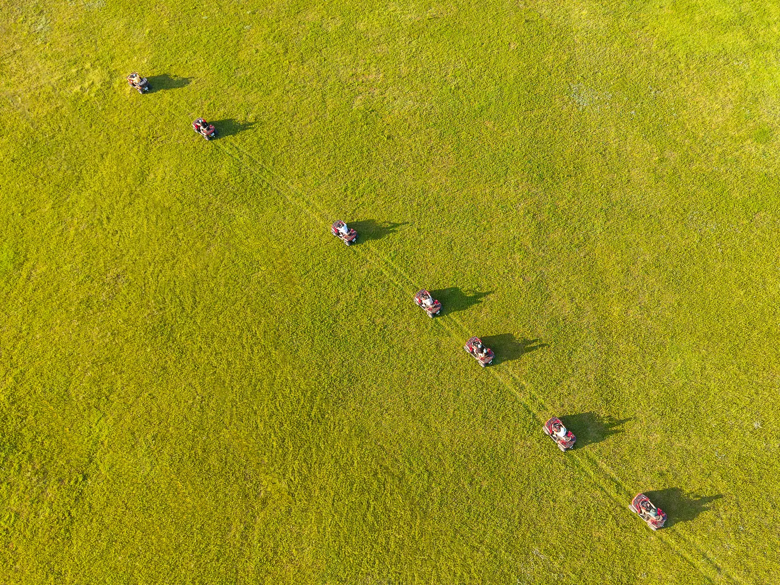 Top-down drone view of the quads parked in formation